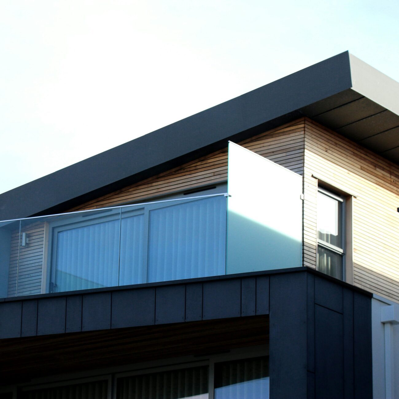Contemporary building facade with sleek lines and glass elements in Poole, UK.